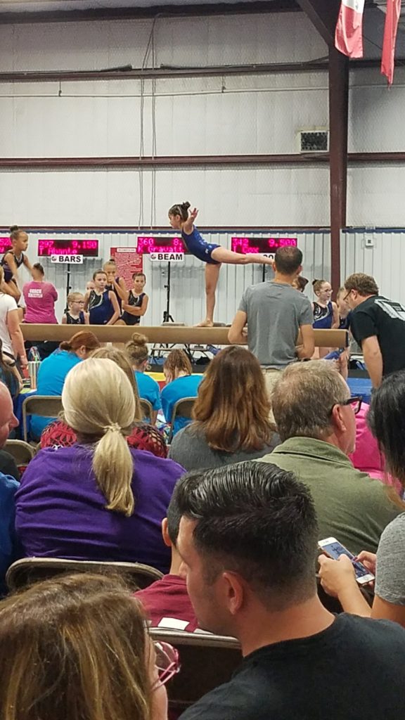My daughter as a level 2 gymnast on the beam