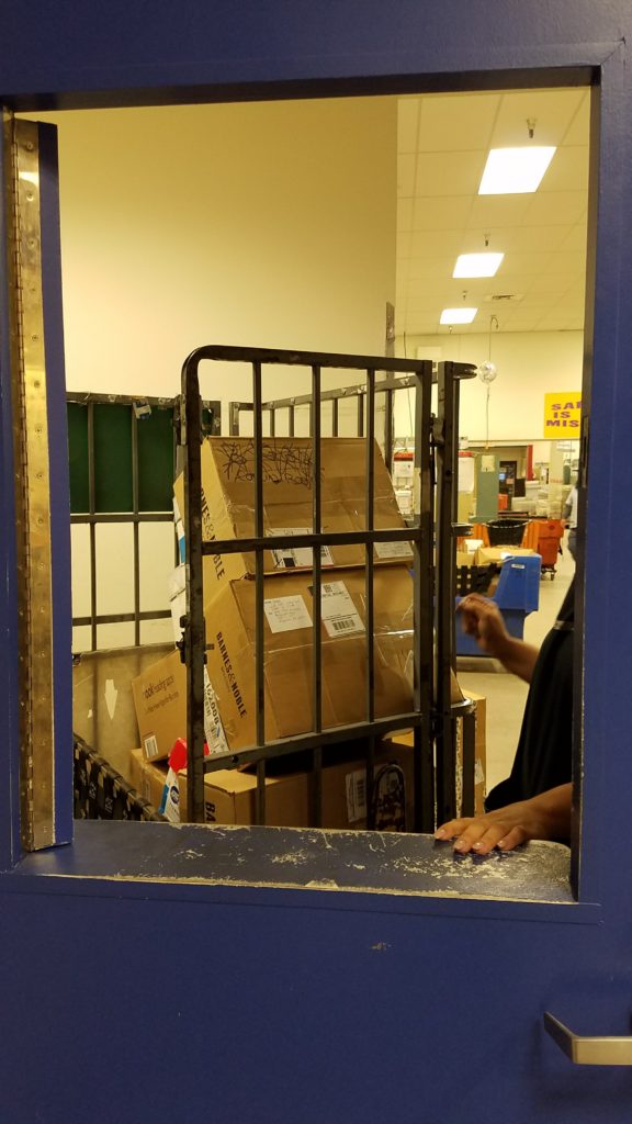 US Post Office window as the boxes head to Puerto Rico