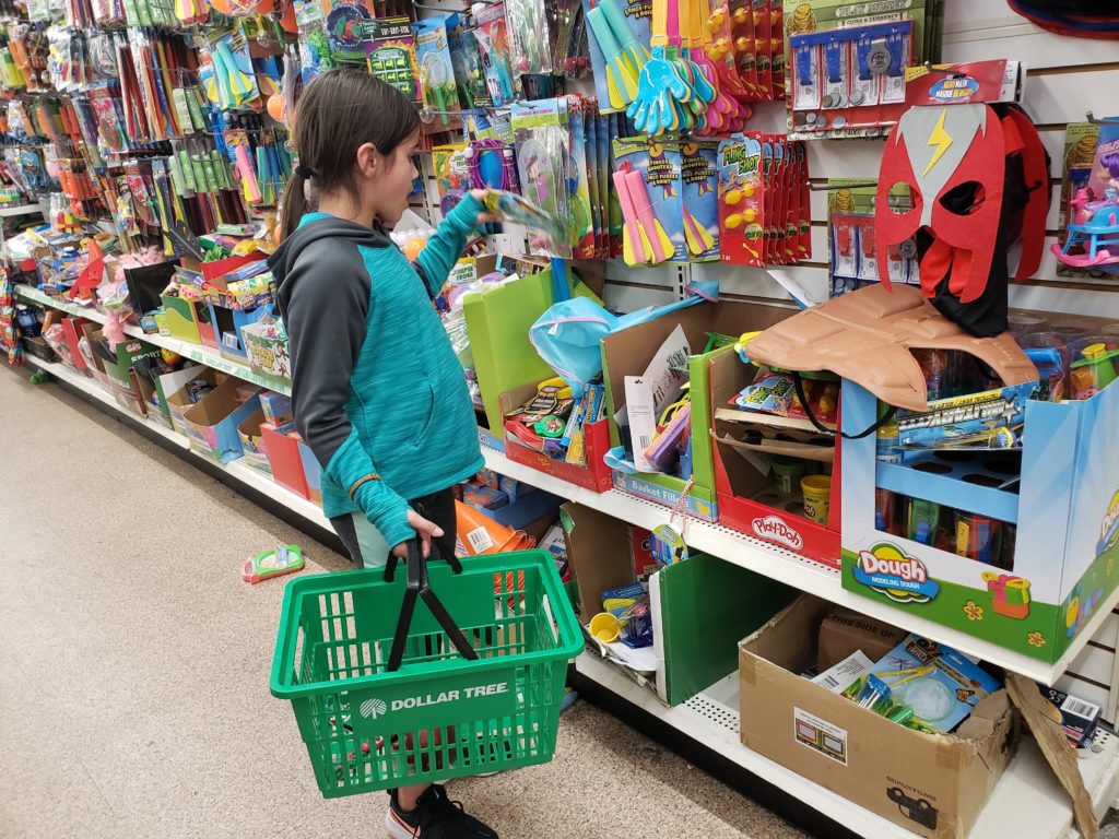 Operation Christmas Child girl surprised at finding perfect toy for the shoebox  she is packing!