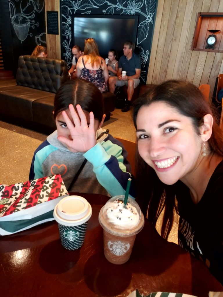 Mom and daughter enjoy Starbucks Holiday Drinks at DIsney Springs Trail of Trees